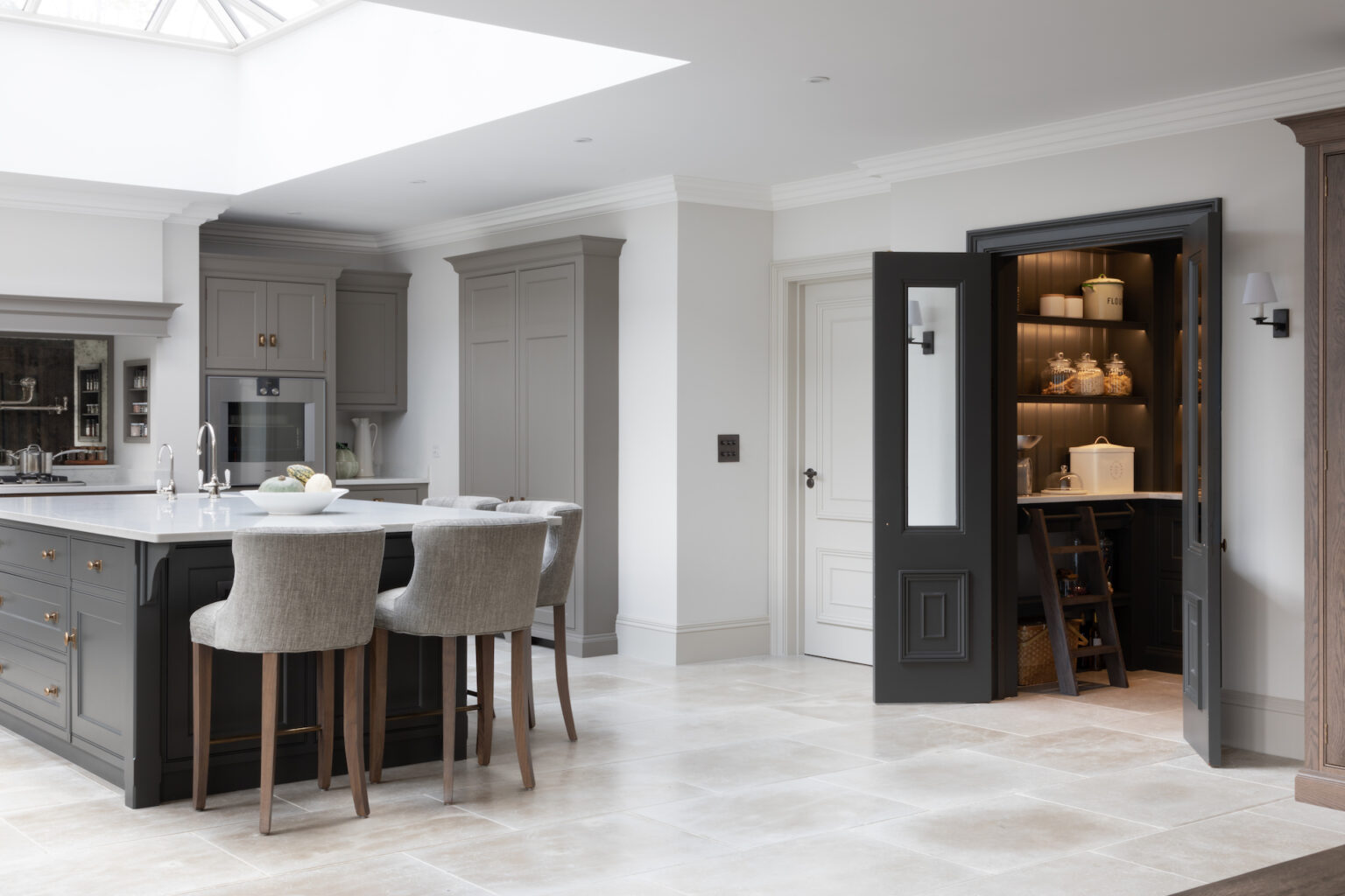 Walk in dark painted cabinetry